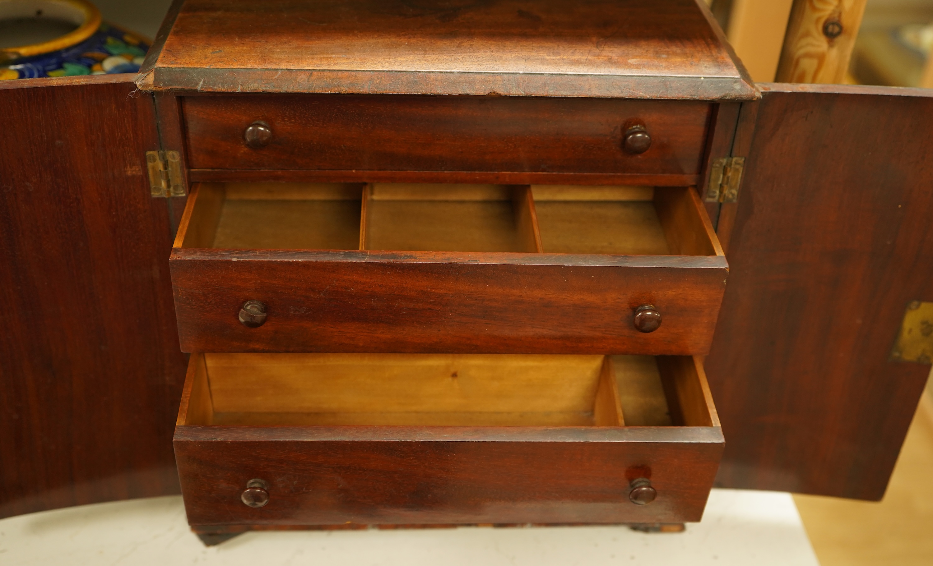 A late 19th century mahogany cabinet fitted with four drawers, 32cm high